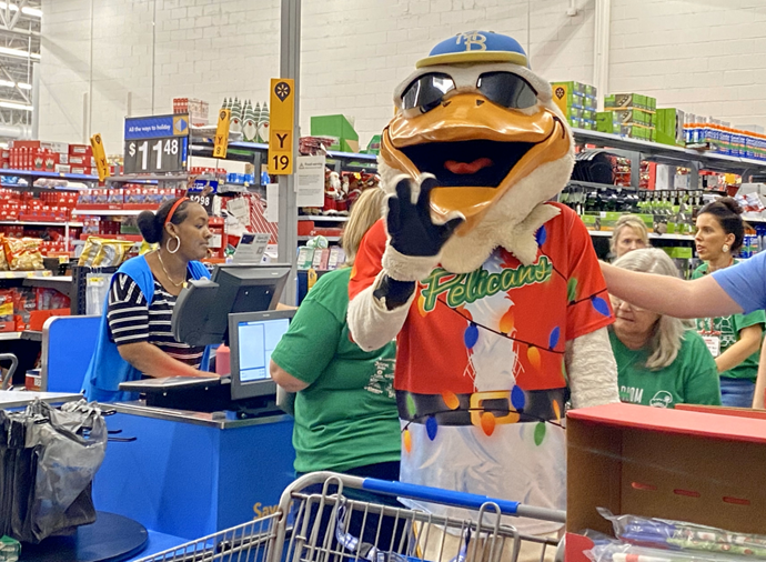 Photo of Pelican mascot in check out line at Walmart store