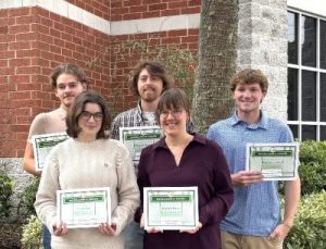 Photo of five students holding certificates